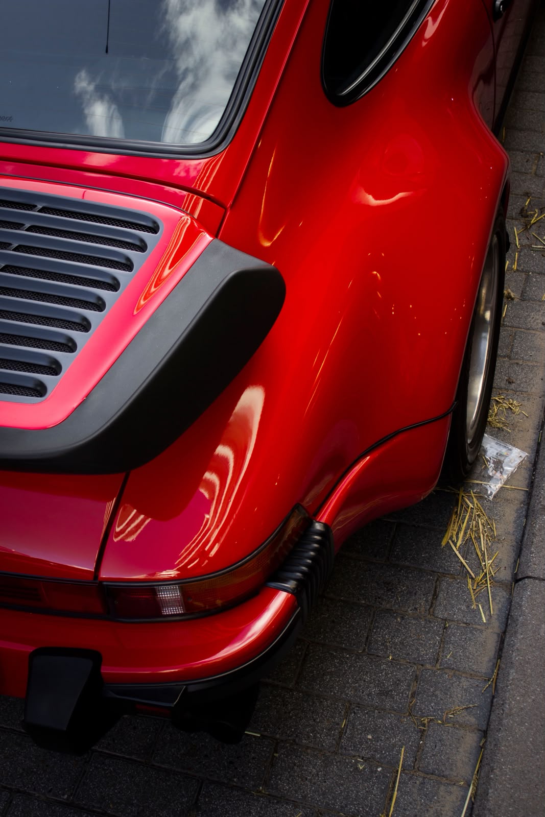 Red classic Porsche 911 detail, softly overlaid